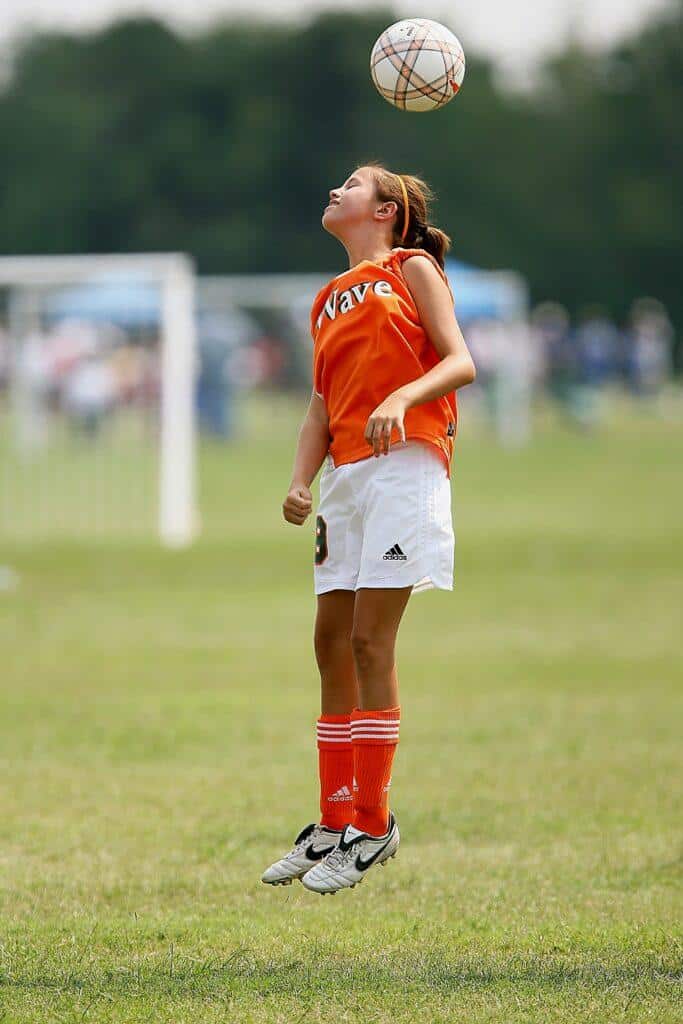 girl playing football